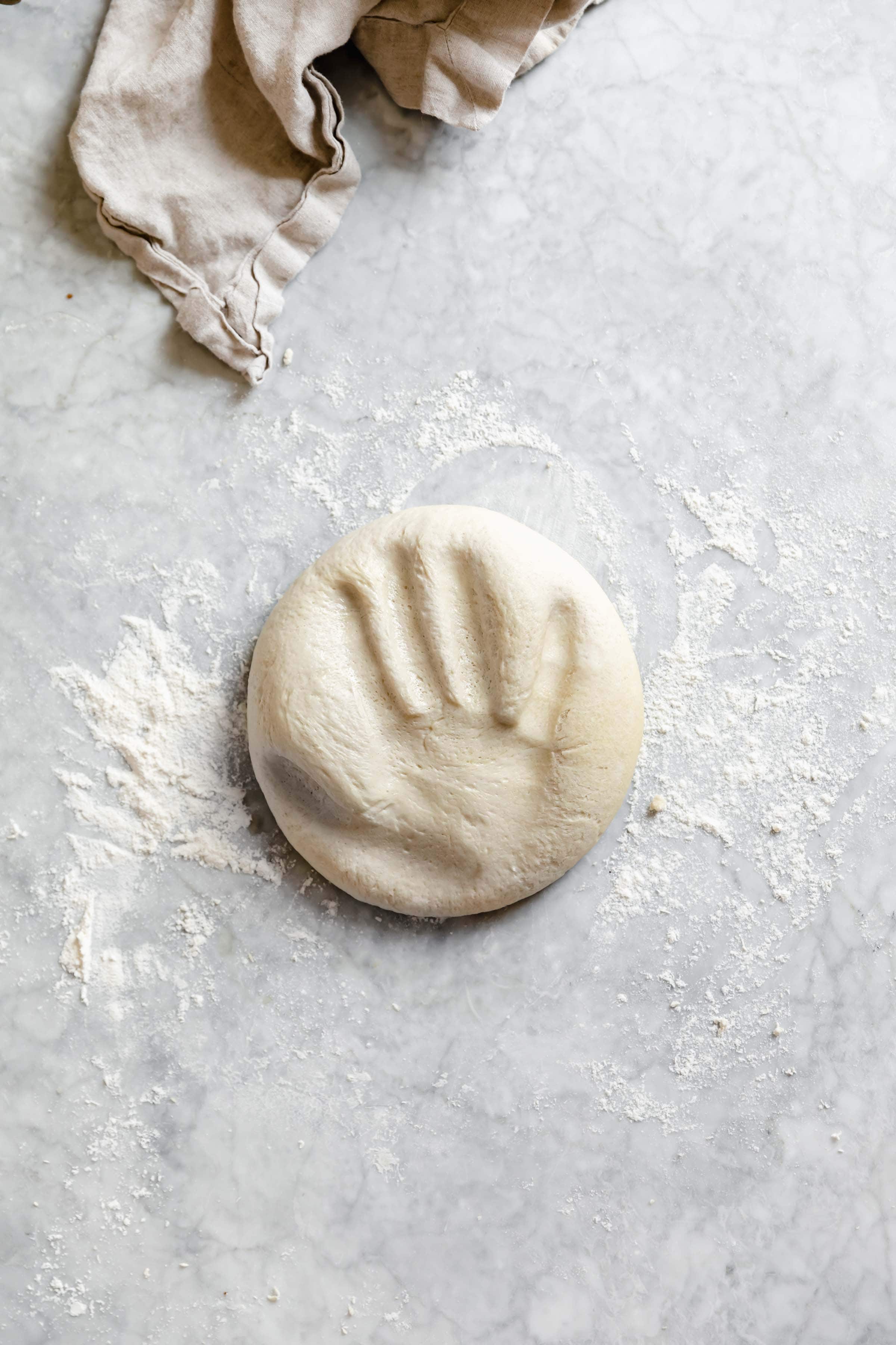 pizza dough with hand print