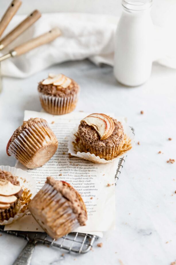 apple carrot muffins scattered over marble counter