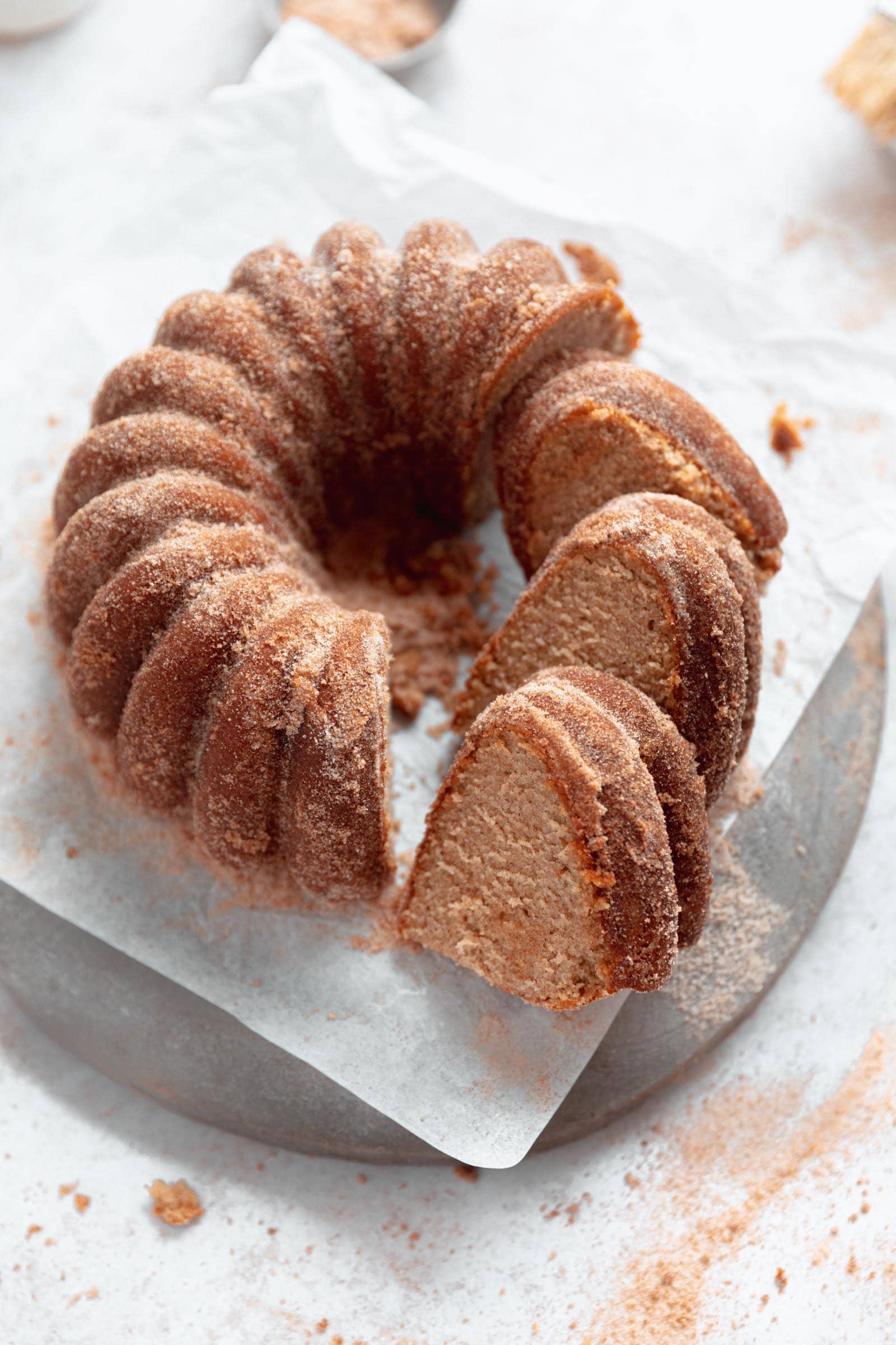 apple cider donut bundt cake cut into slices