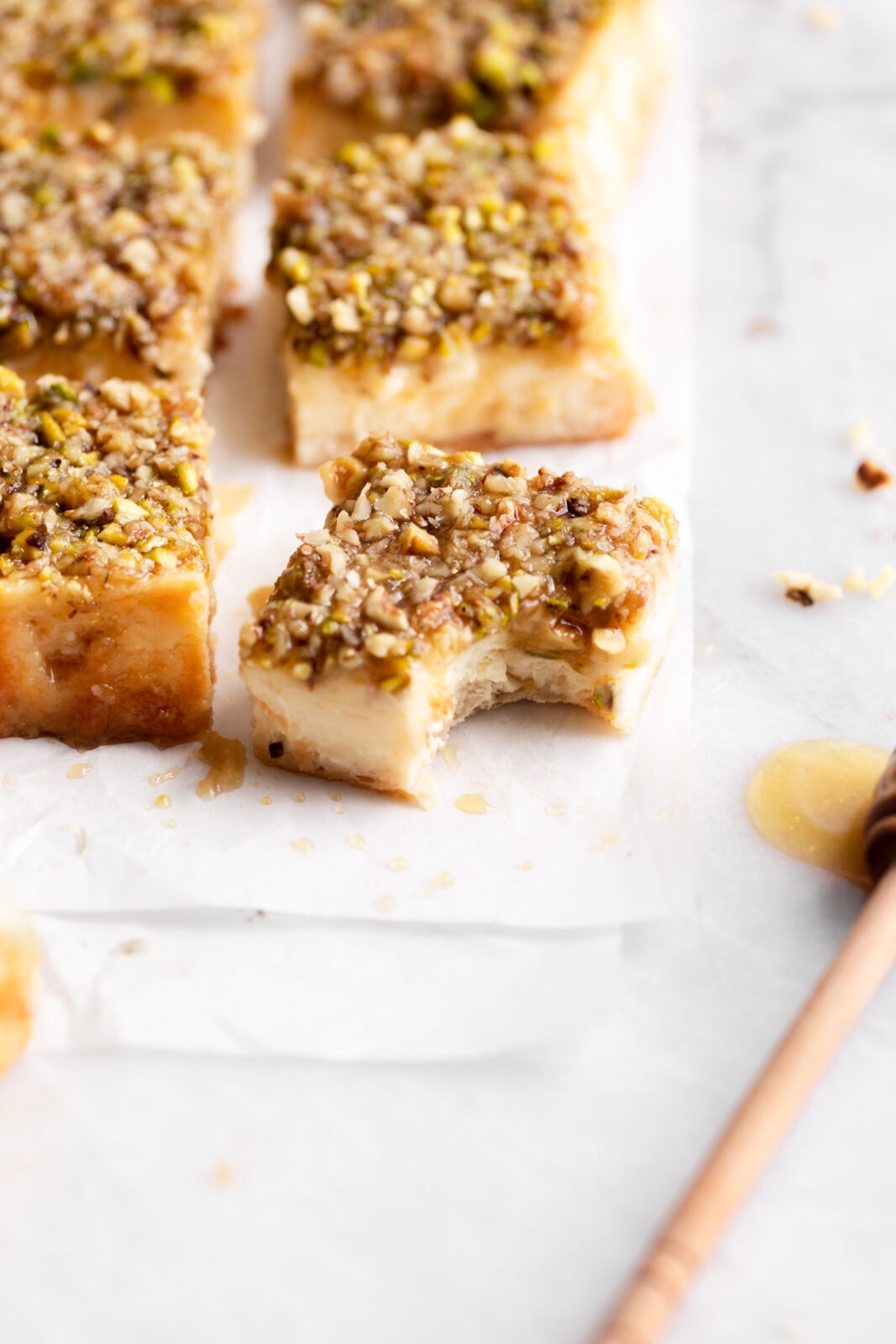 baklava cheesecake bar with bite taken out