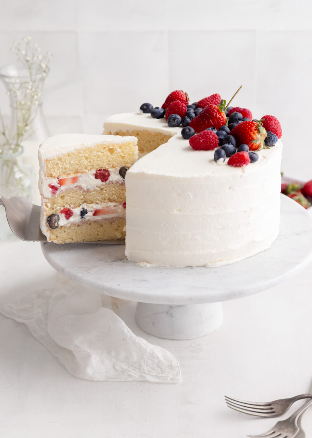 berry chantilly cake with whipped cream and berries