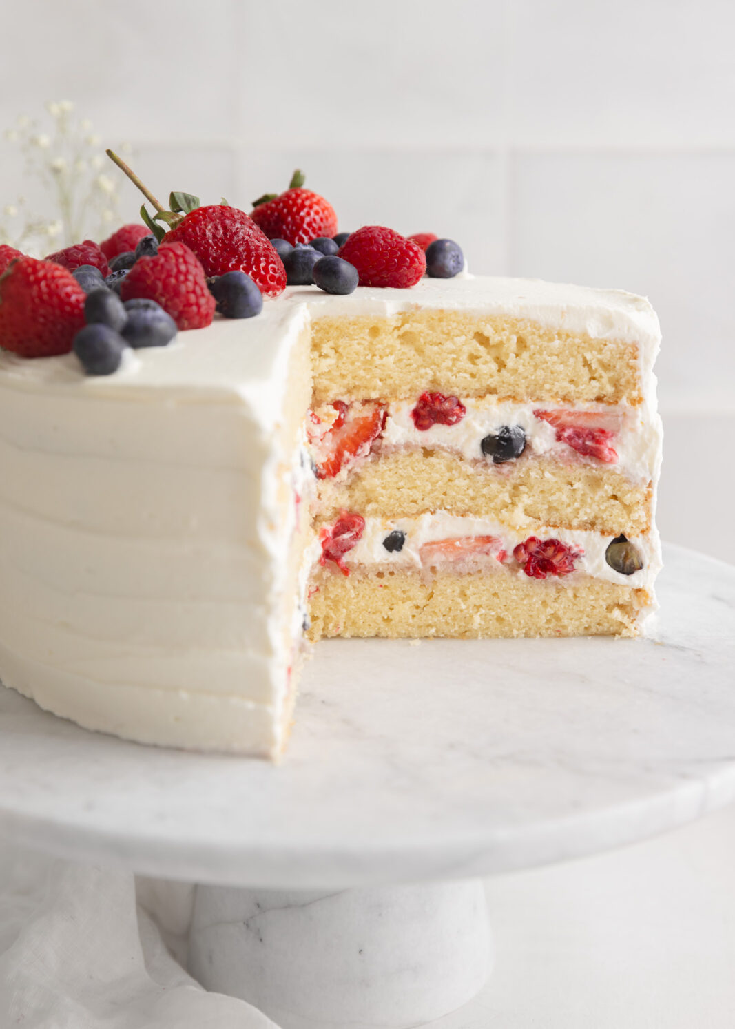 berry chantilly cake with whipped cream and fresh berries
