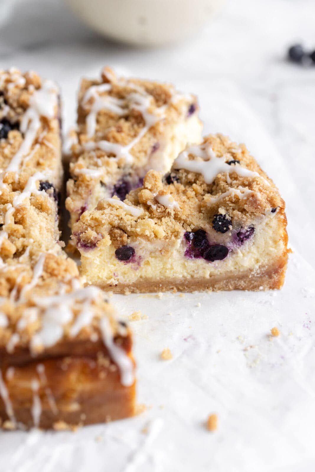 blueberry streusel cheesecake with blueberries and crumb topping