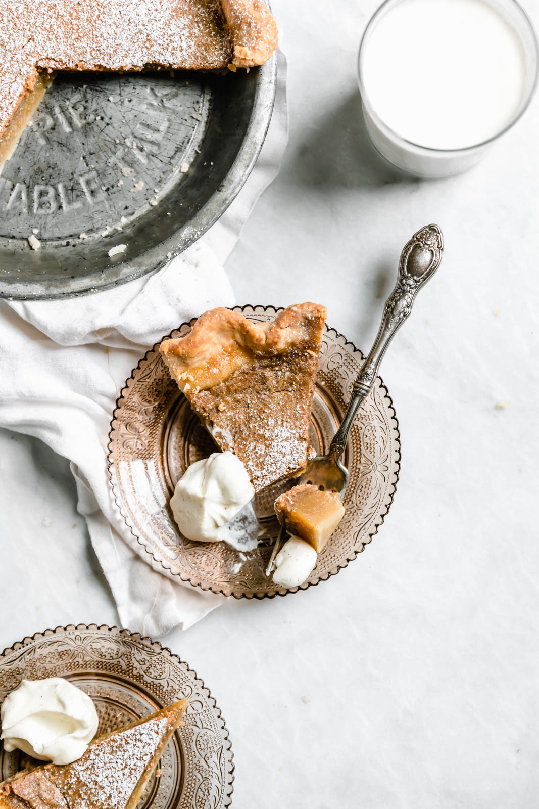 slice of Brown Butter Maple Chess Pie on glass plate