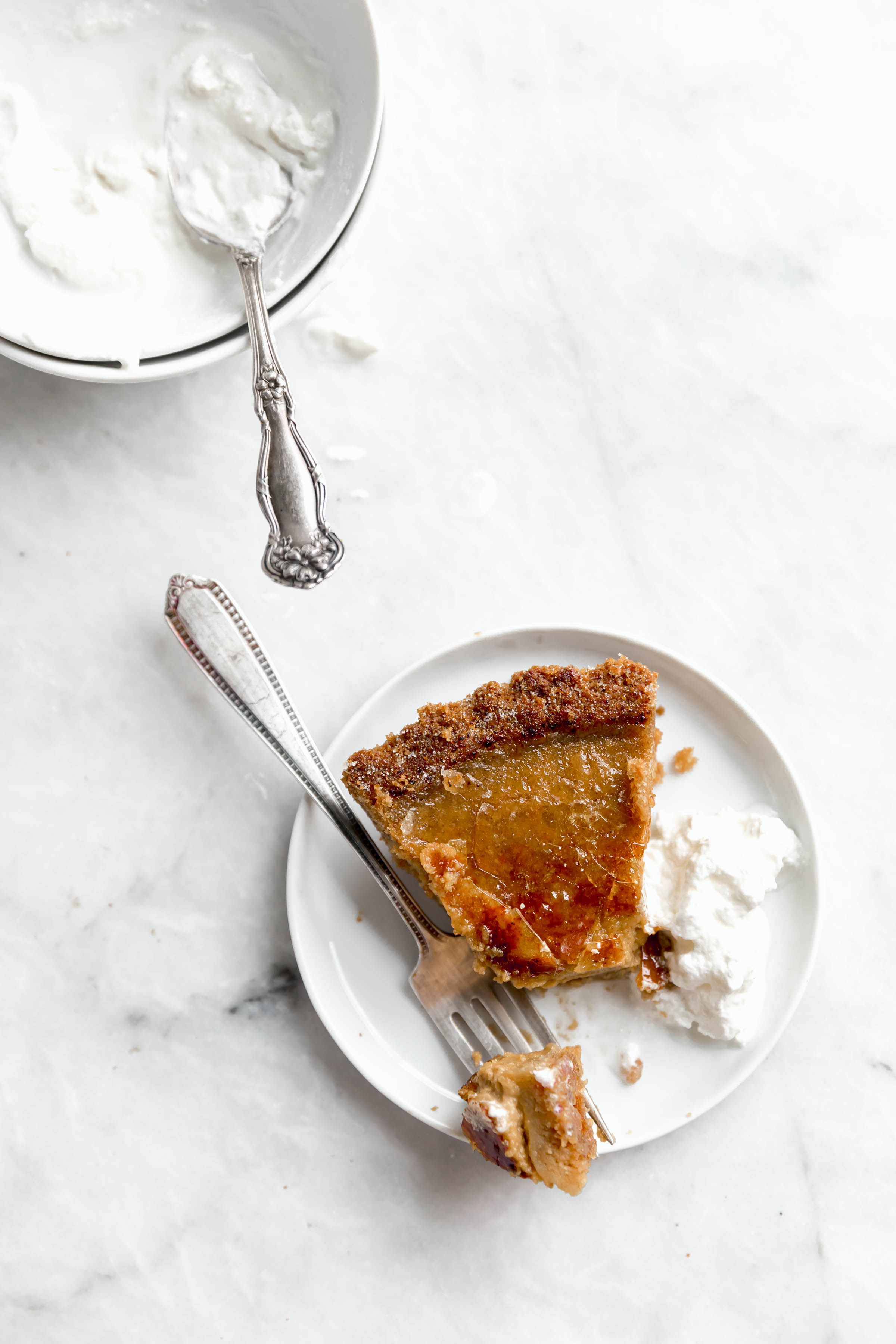 slice of bruleed pumpkin pie with whipped cream