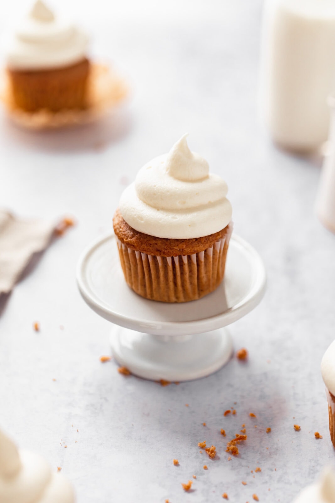 homemade carrot cake cupcake on a cupcake stand