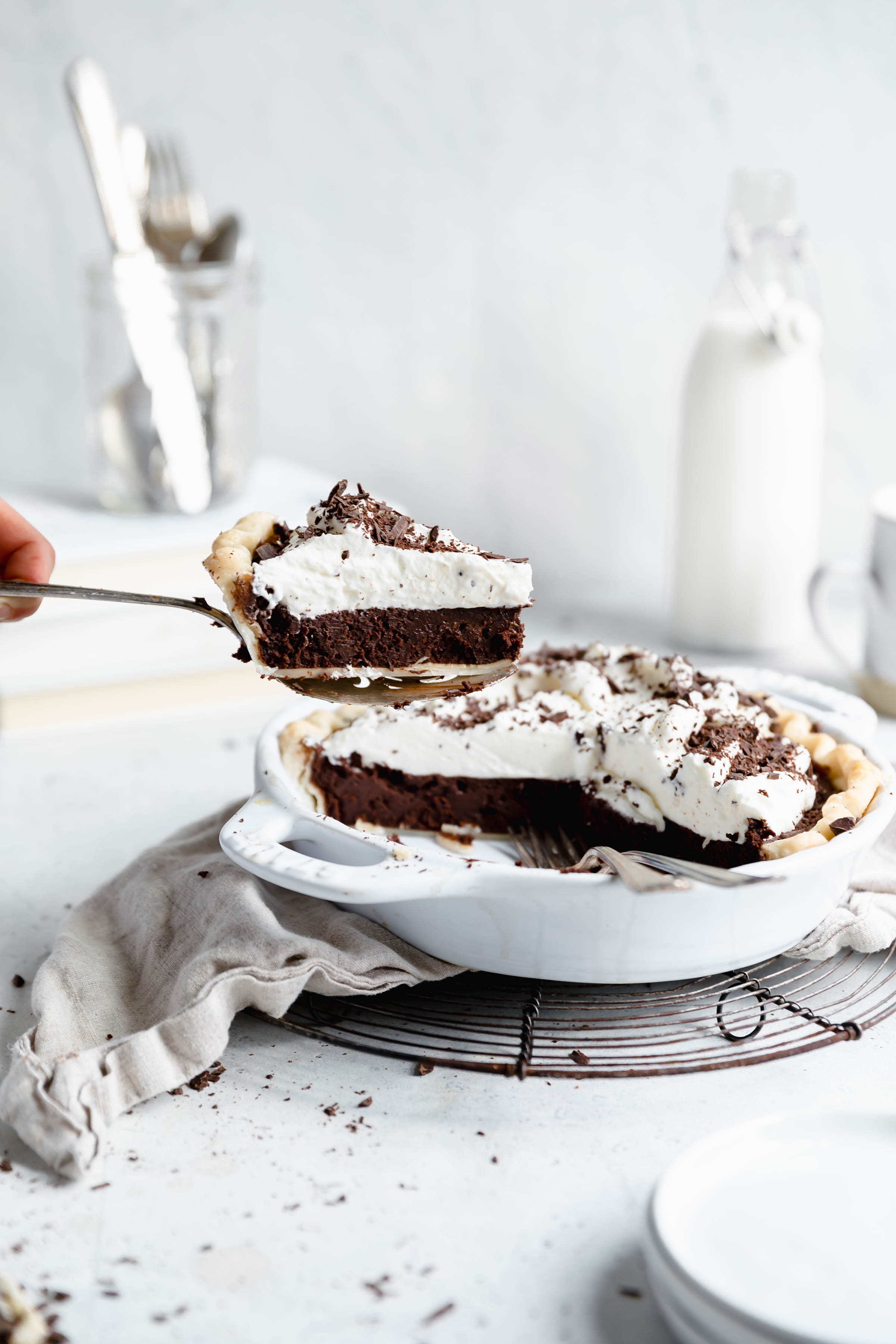 slice of the best chocolate fudge pie lifted out of pie