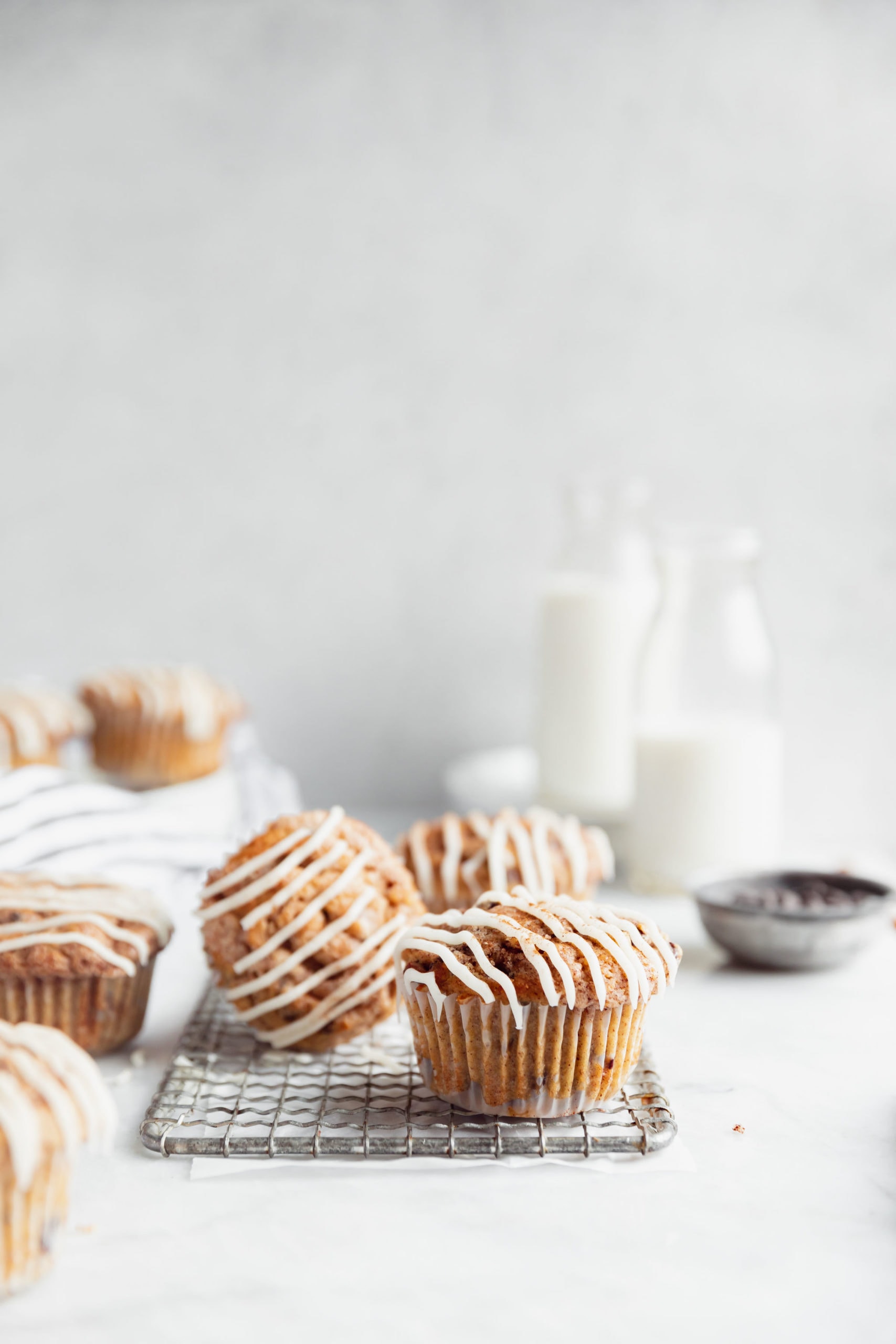 cinnamon swirl chocolate chip muffins on a cooling rack