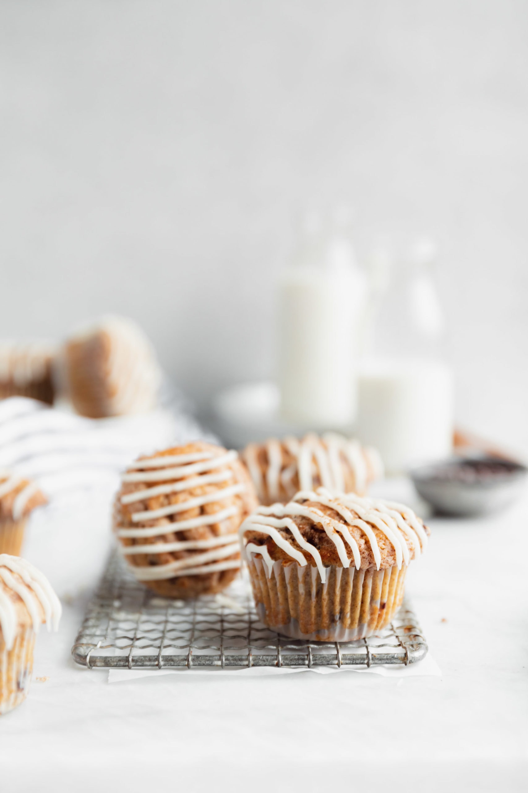 cinnamon chocolate chip muffins drizzled with icing