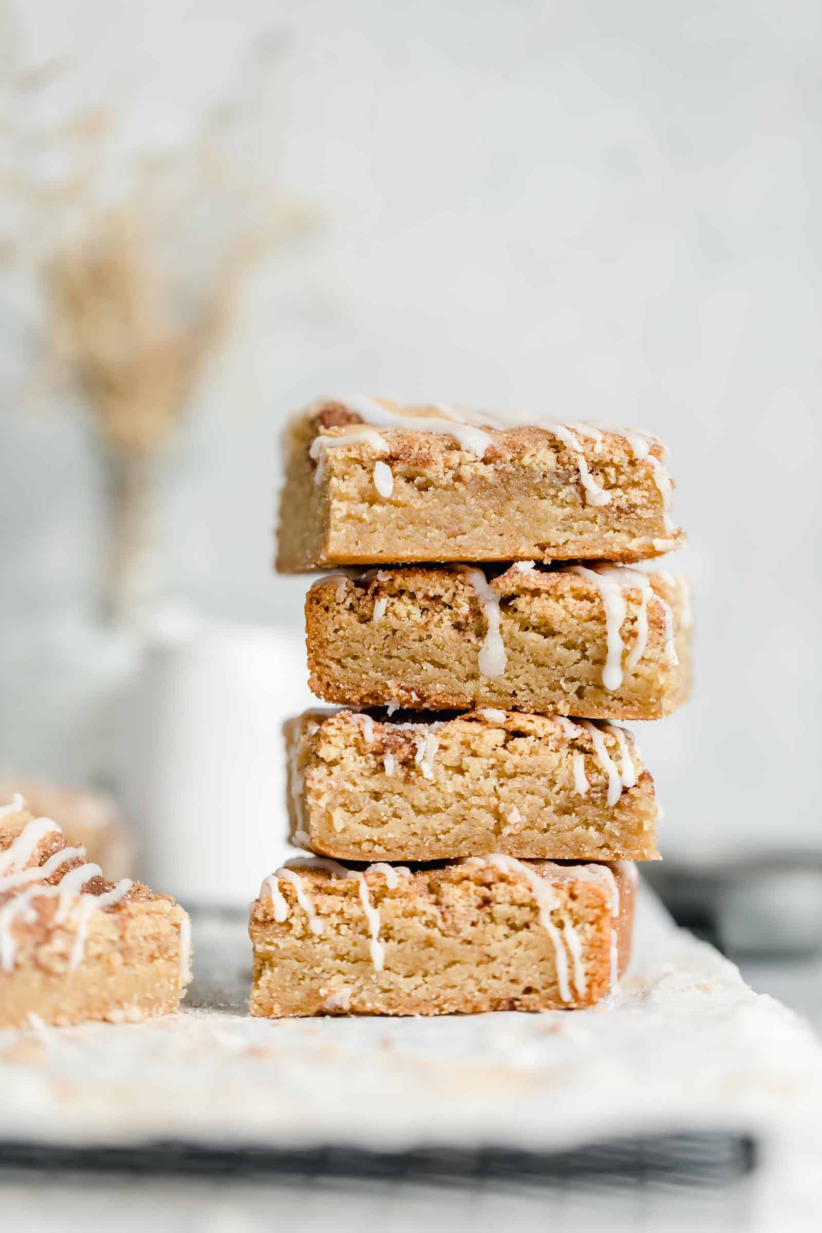 stack of cinnamon sugar blondies drizzled with icing