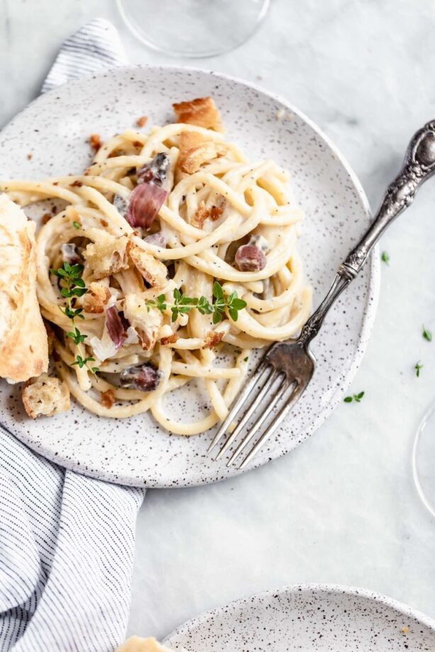 A creamy Roman classic made with bucatini, guanciale, parmigiano, and egg yolks, this Date Night Pasta Carbonara is perfectly portioned for two!