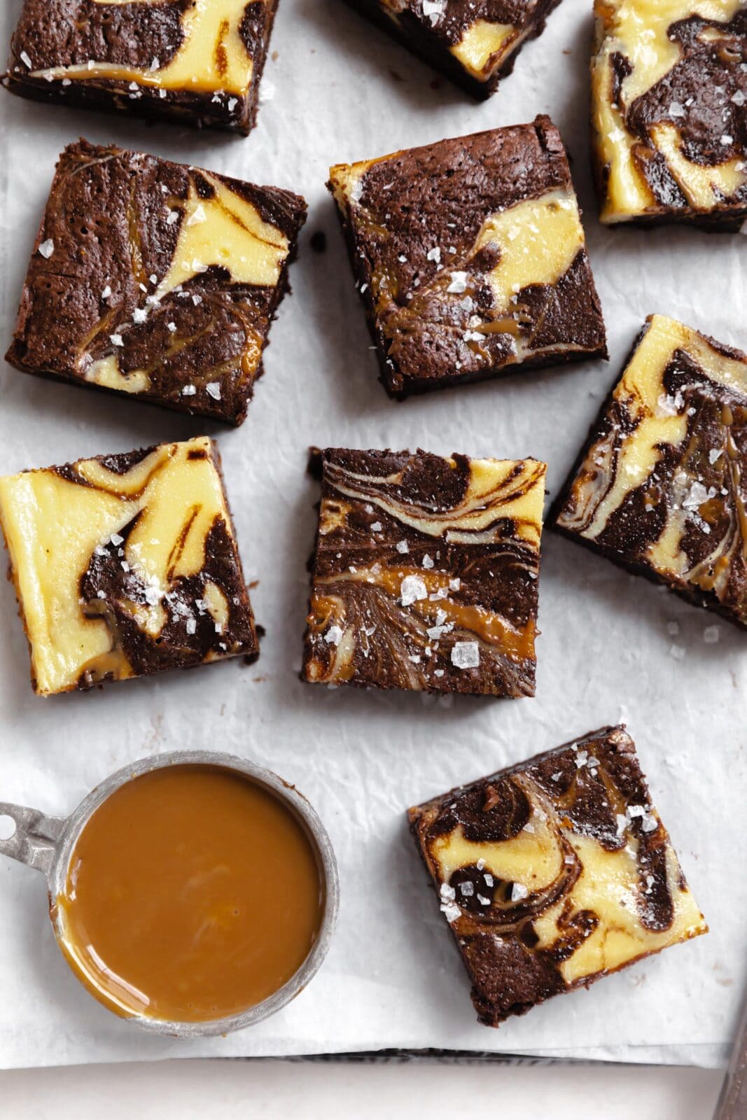 dulce de leche cheesecake brownies on a pan