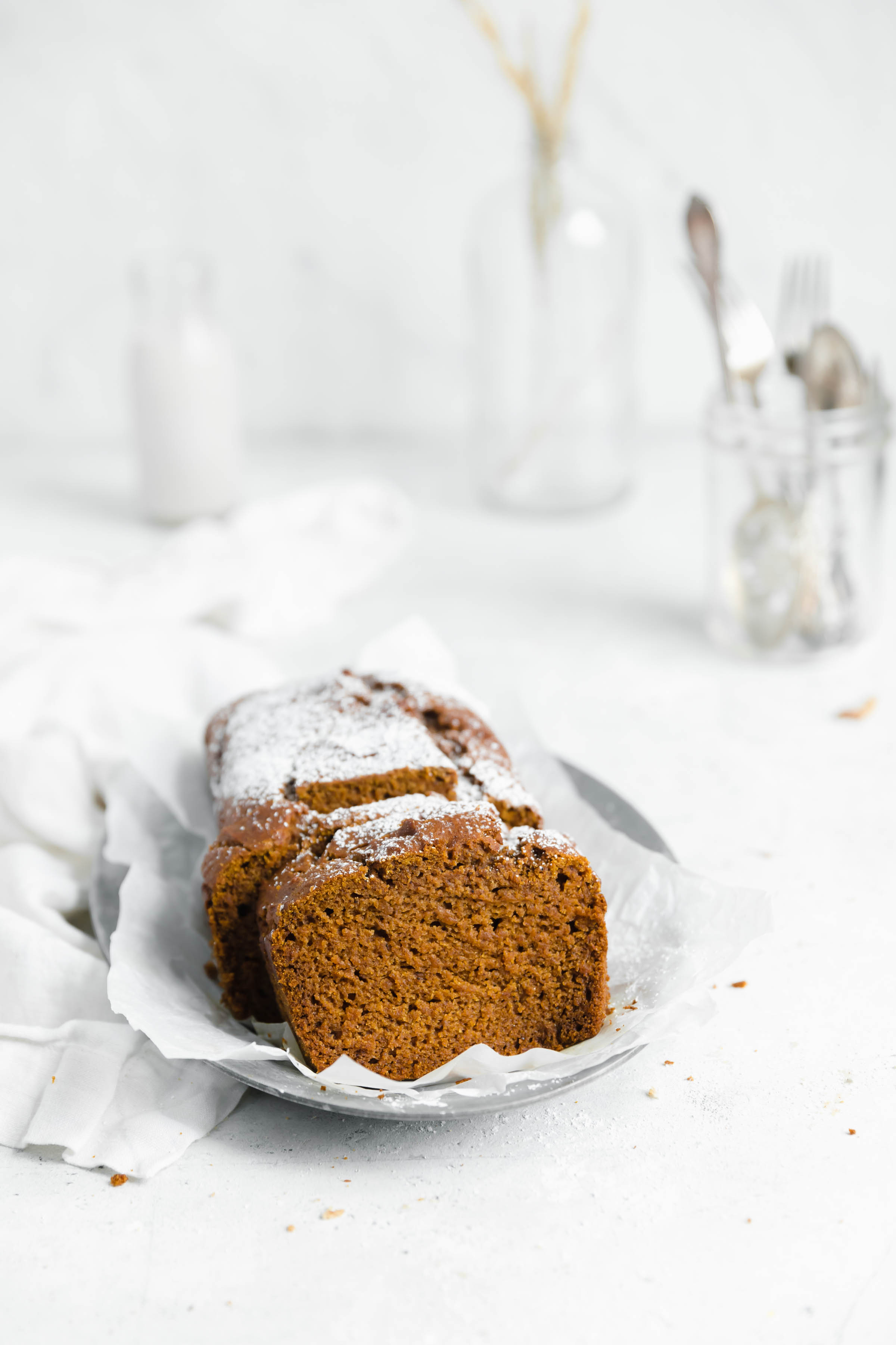 head on shot of gluten free pumpkin bread slices with powdered sugar sprinkled on top