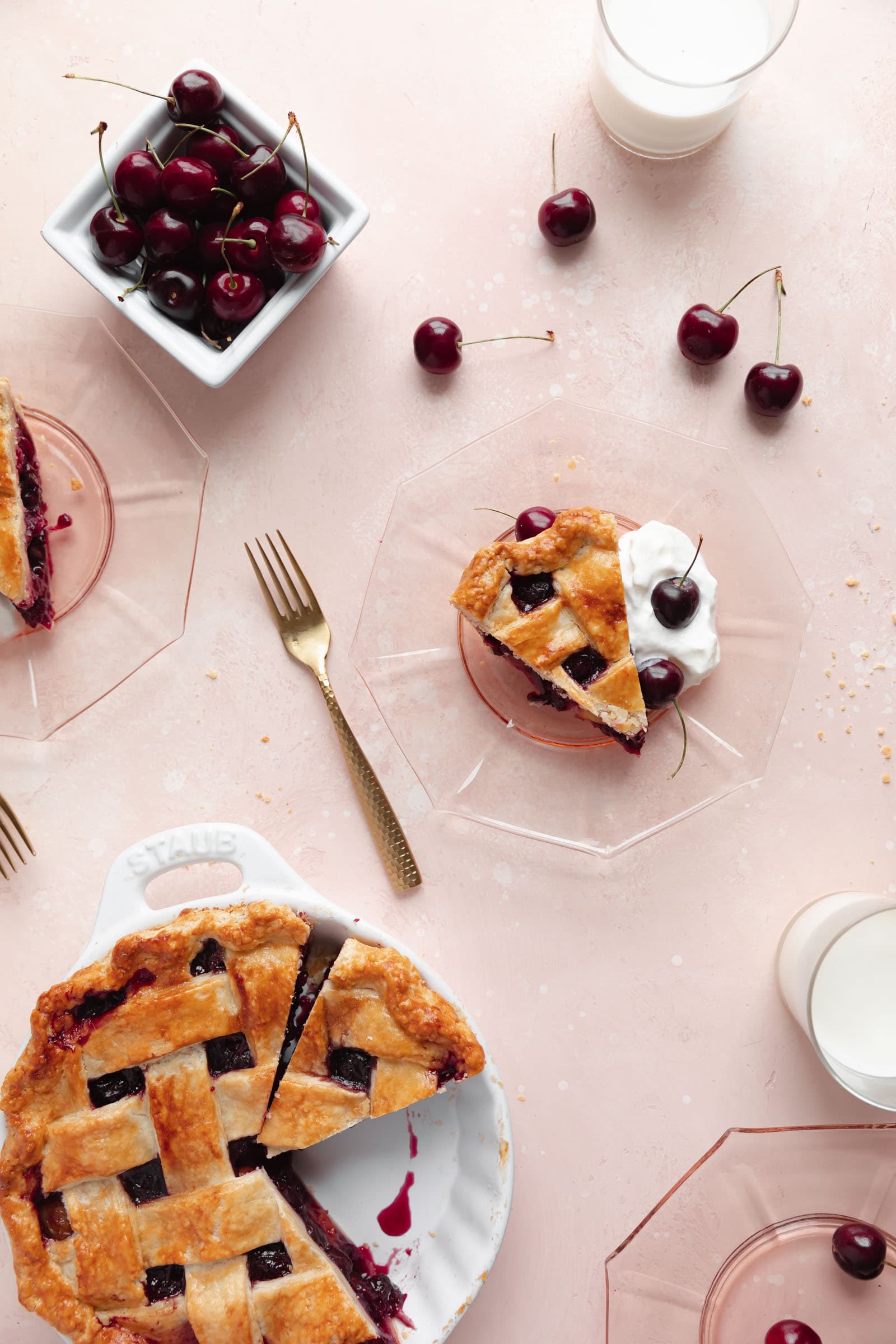 homemade cherry pie with a slice taken out on a place