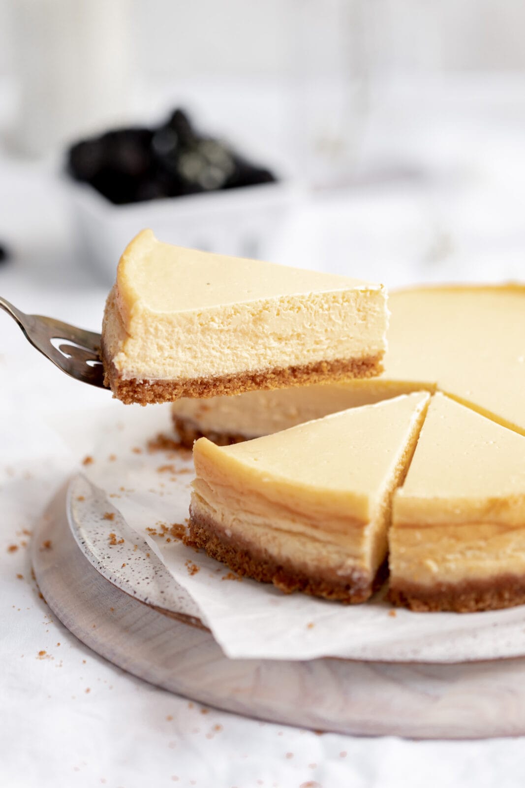 slice of homemade cheesecake with graham cracker crust