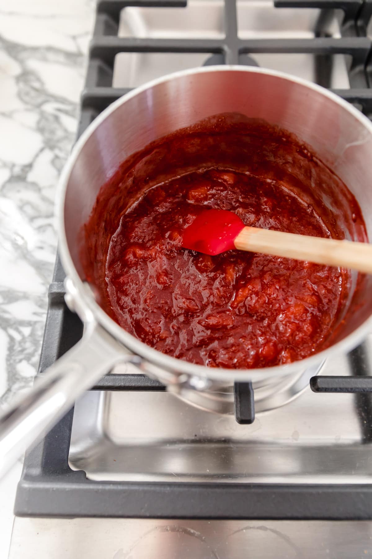 strawberries cooking down in pot