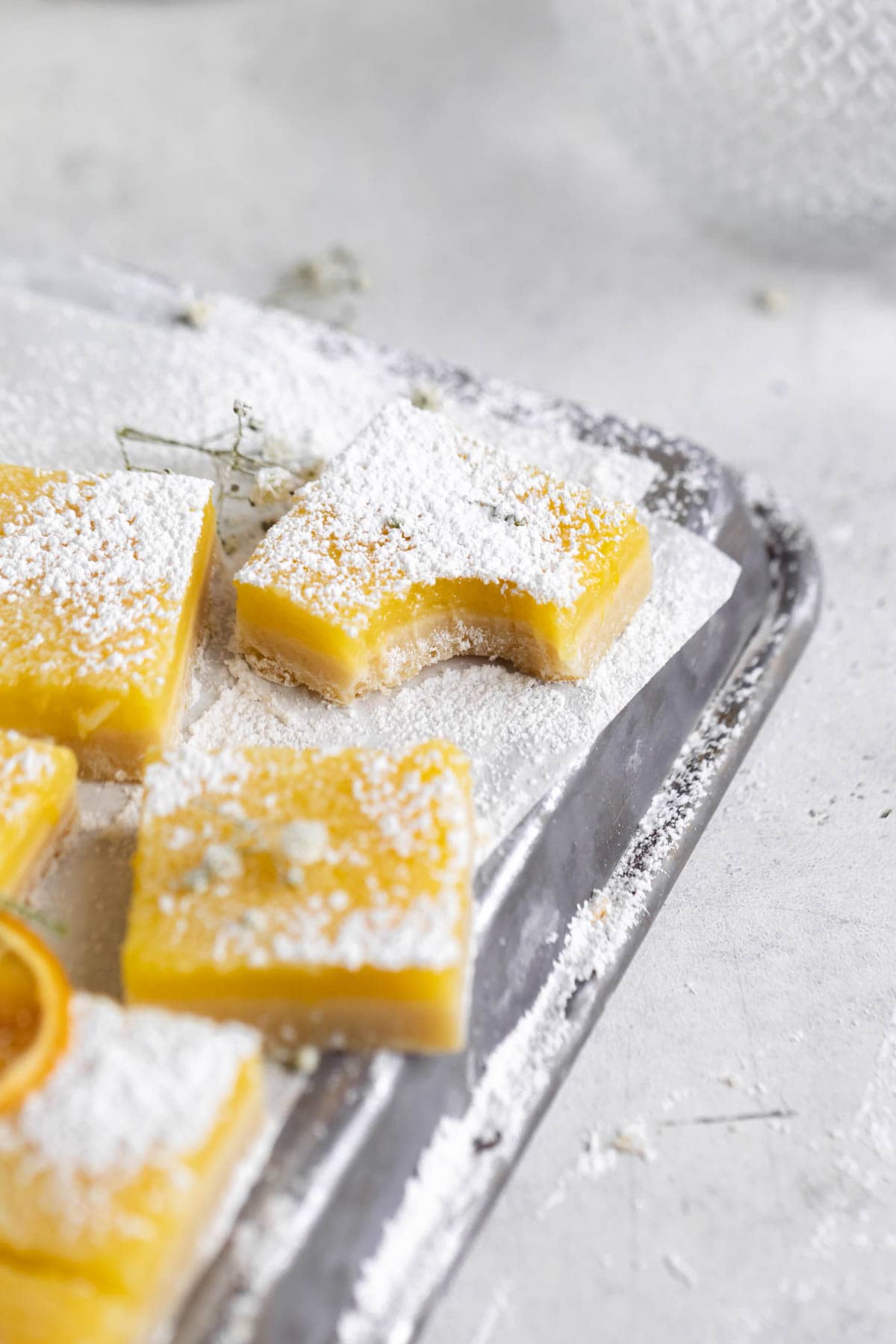lemon squares with a bite taken out