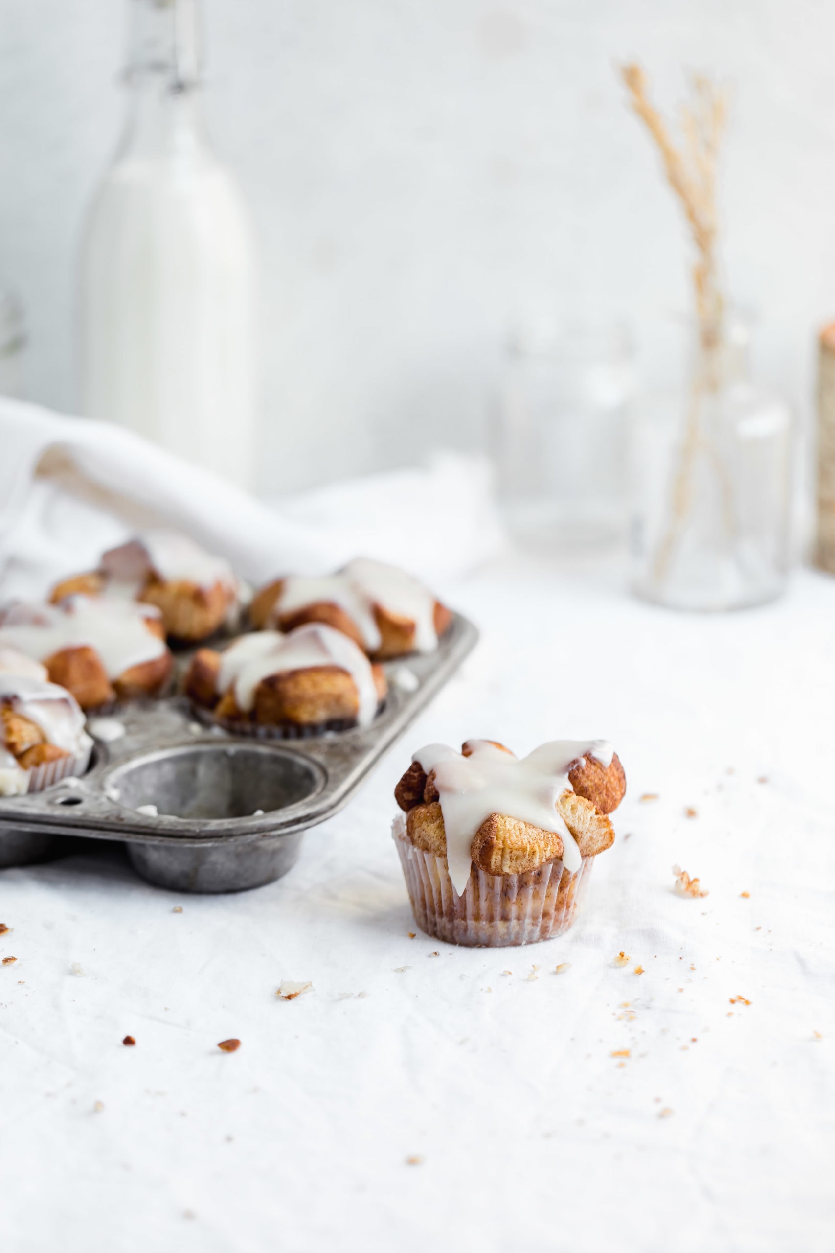monkey bread muffins in a cupcake tin with one out of the tin