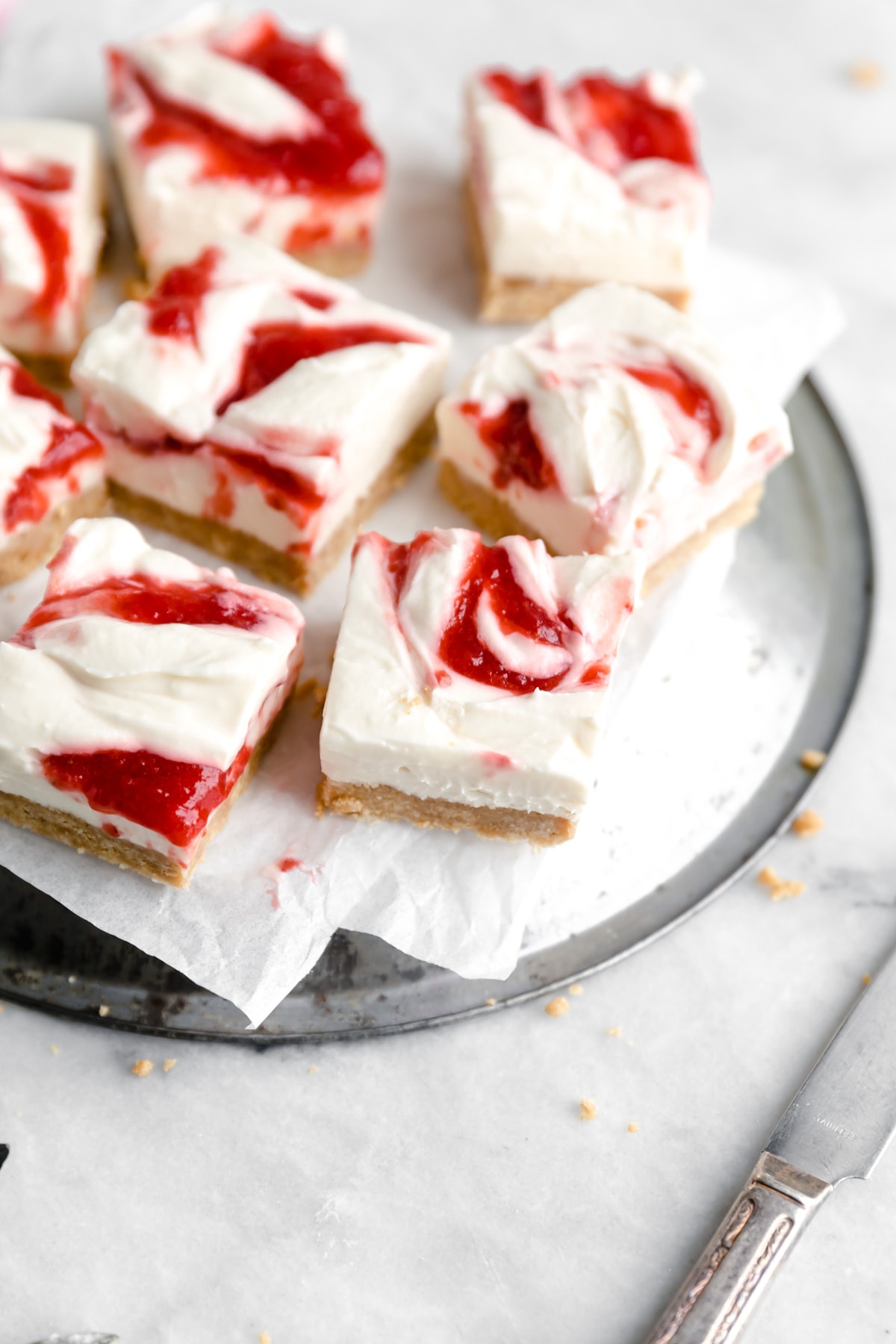 no bake strawberry cheesecake bars cut into squares