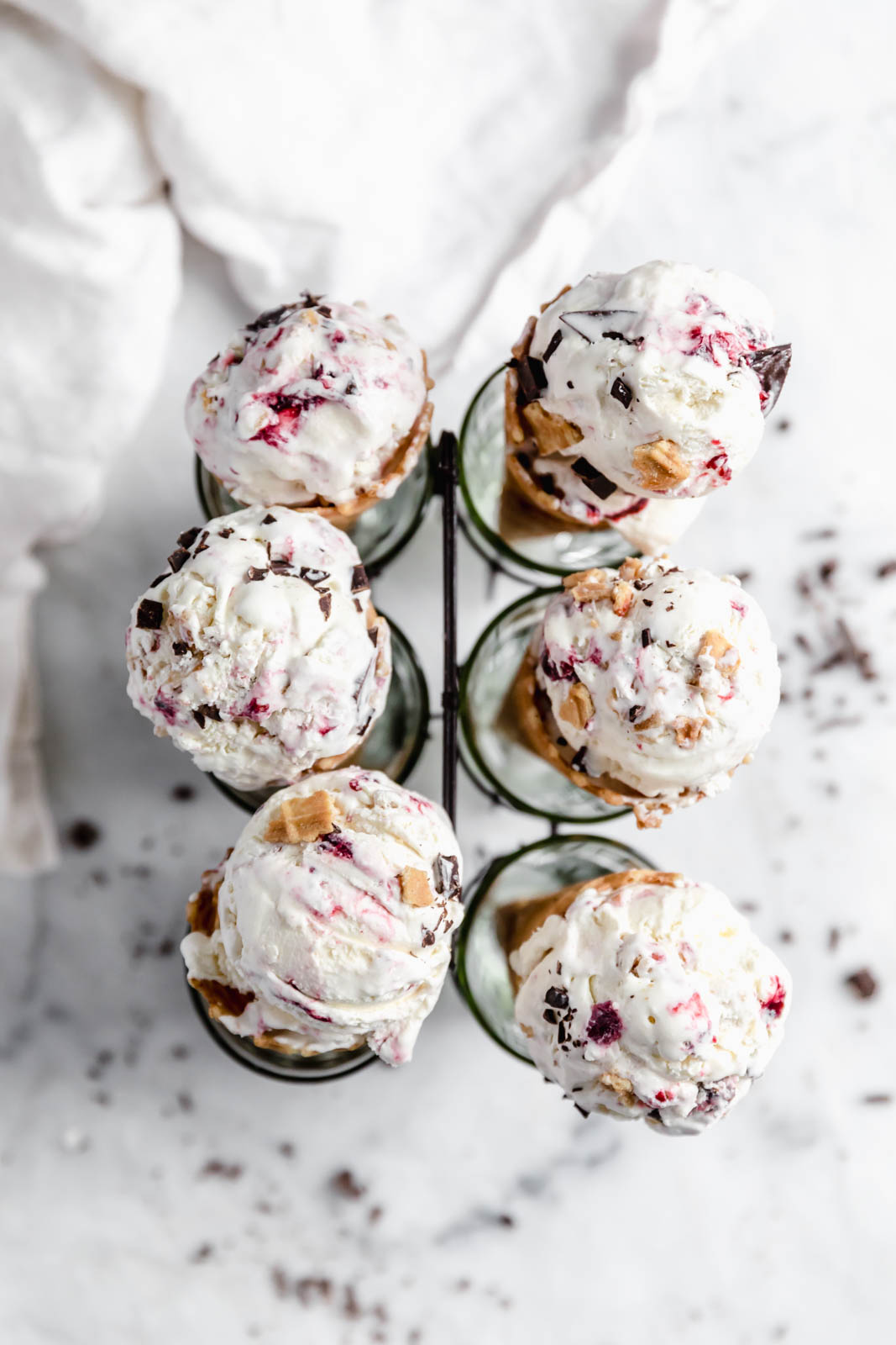 This creamy vanilla ice cream with fat blackberry swirls, buttery waffle pieces, and chocolate chips has us in heaven. Whip up this no churn blackberry waffle chocolate chip ice cream in minutes and skip the line at the ice cream shop.