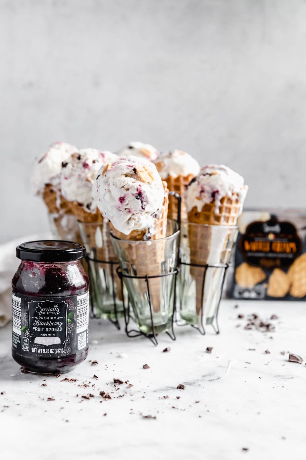 This creamy vanilla ice cream with fat blackberry swirls, buttery waffle pieces, and chocolate chips has us in heaven. Whip up this no churn blackberry waffle chocolate chip ice cream in minutes and skip the line at the ice cream shop.