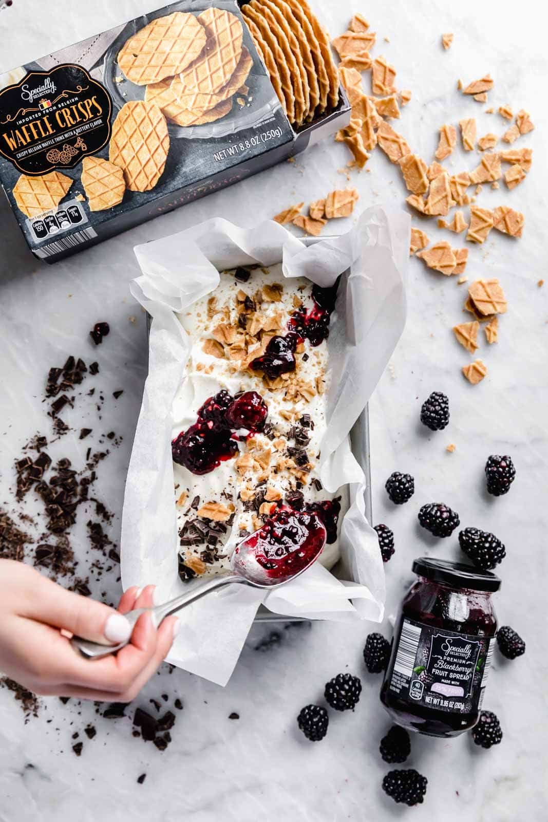 This creamy vanilla ice cream with fat blackberry swirls, buttery waffle pieces, and chocolate chips has us in heaven. Whip up this no churn blackberry waffle chocolate chip ice cream in minutes and skip the line at the ice cream shop.