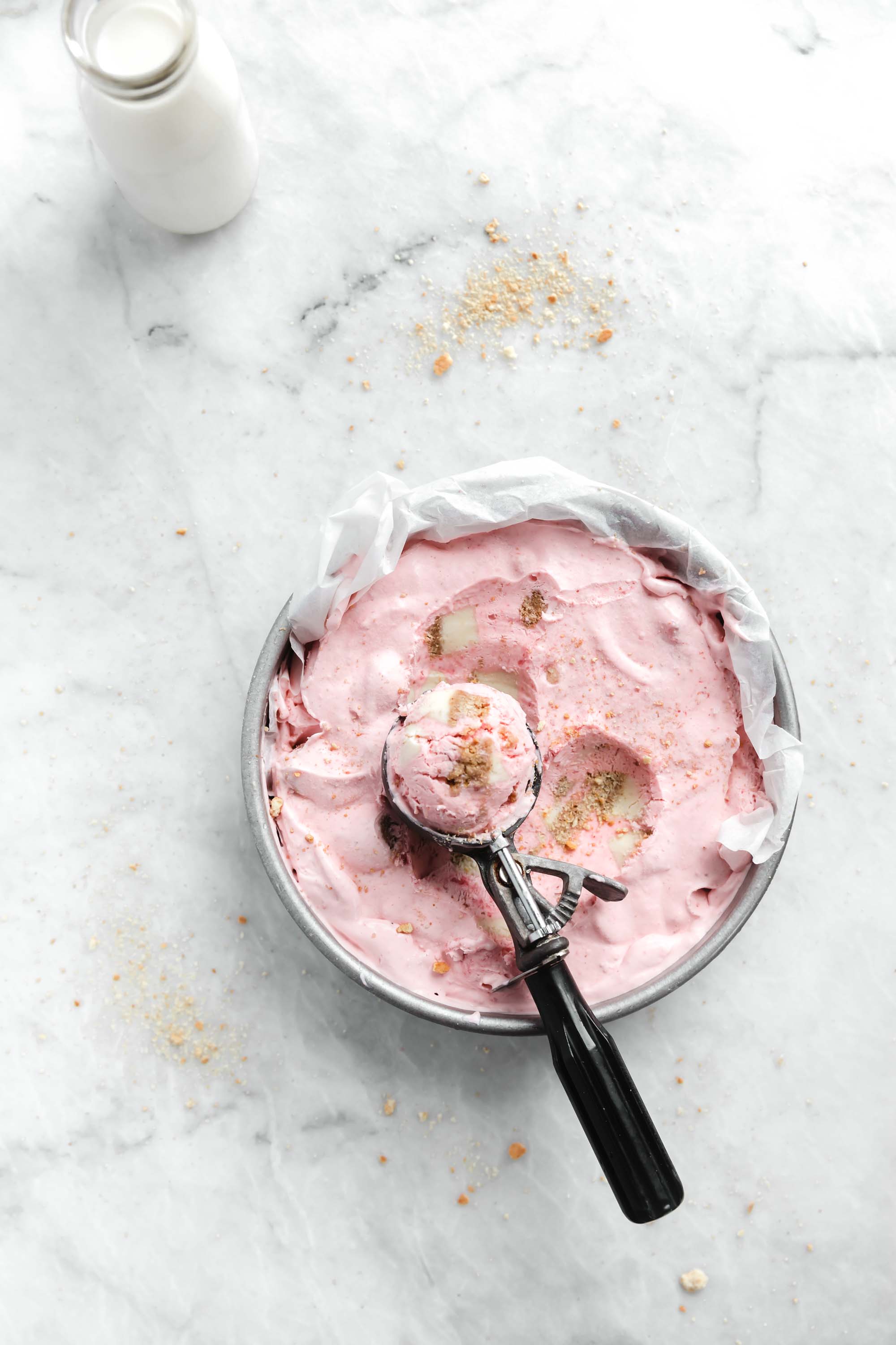 Kick off ice cream season with this easy and delicious no churn strawberry cheesecake ice cream. Creamy strawberry ice cream mixed with chunks of cheesecake. YUM.