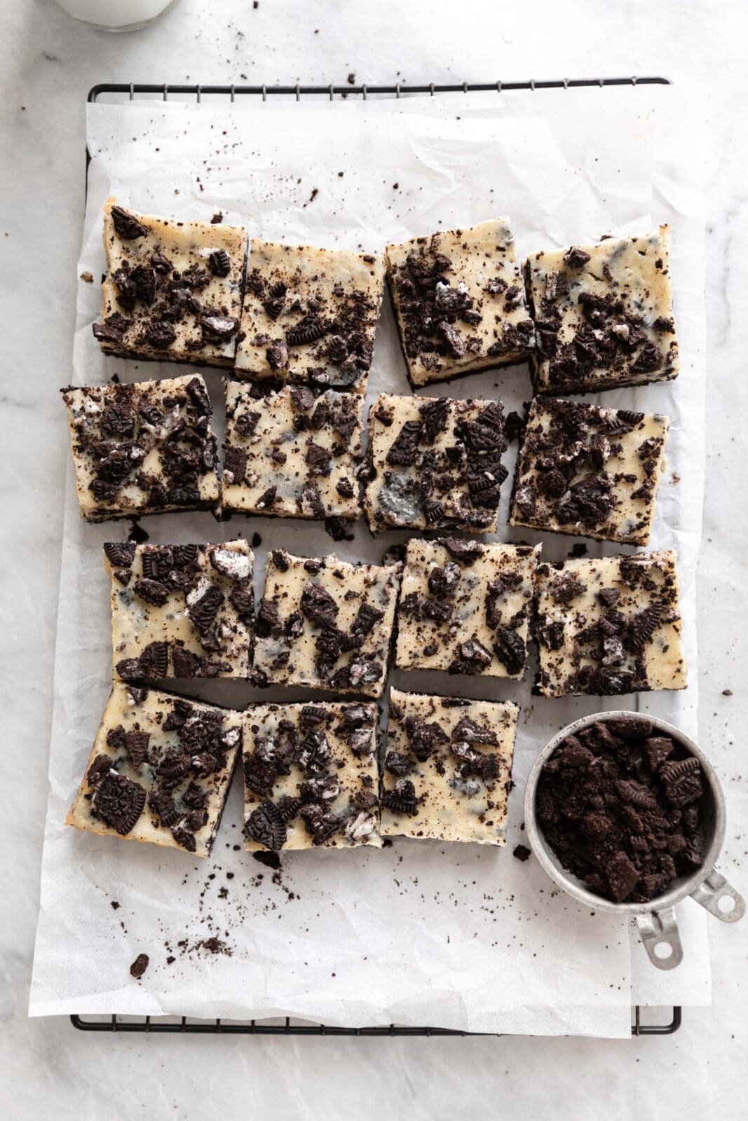 oreo cheesecake bars on a cooling rack