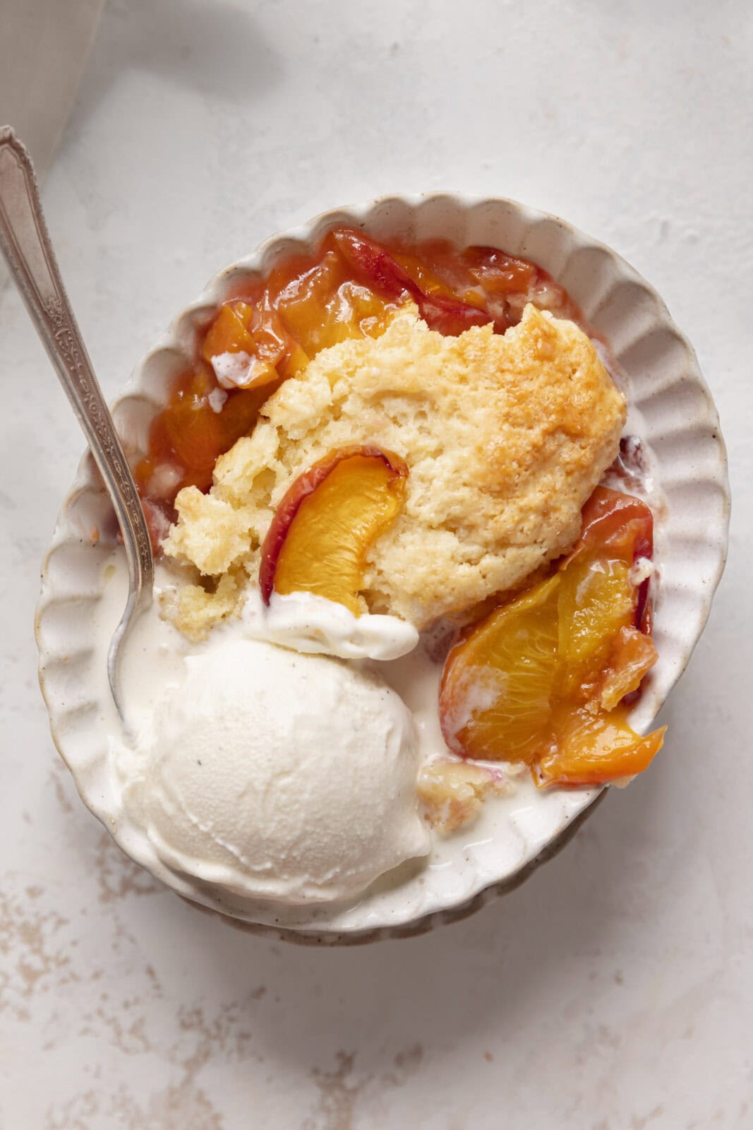 peach cobbler with vanilla ice cream