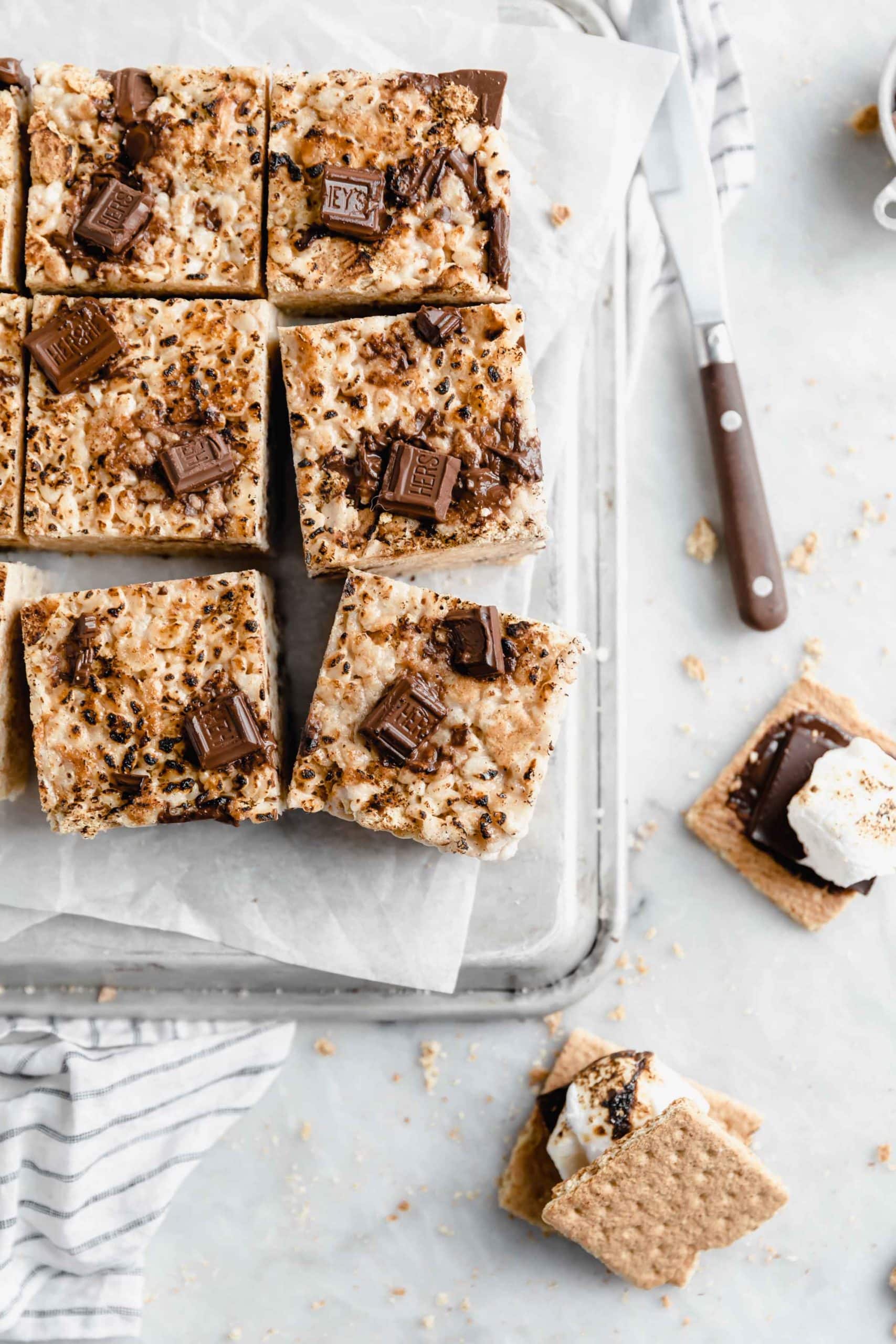 overhead shot of smores rice krispie treats with chunks of hersheys milk chocolate