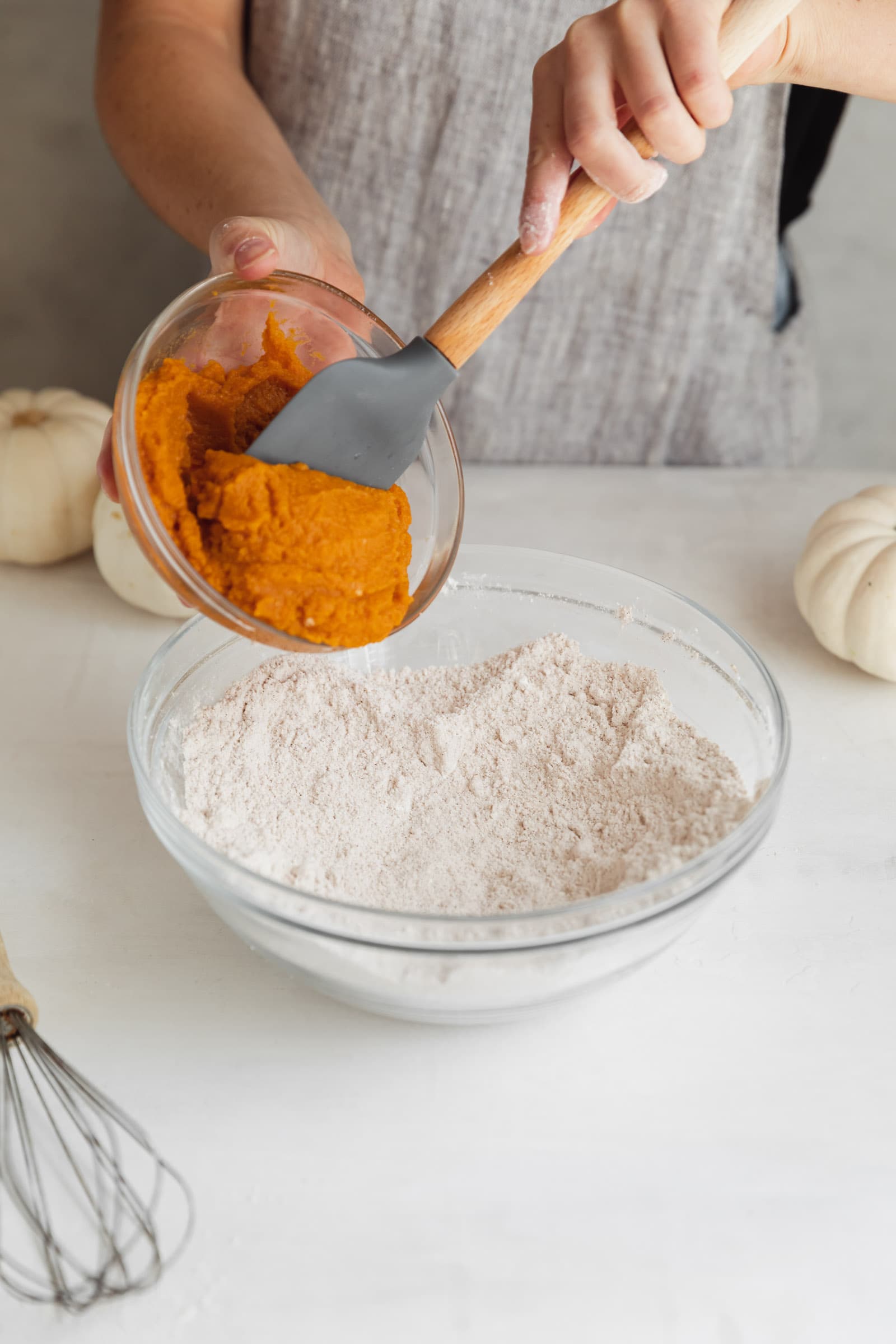 pumpkin going into a bowl