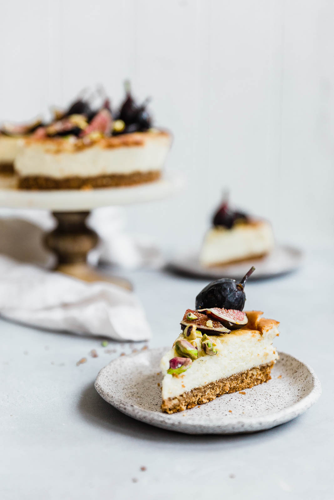 Vanilla bean cheesecake slices on plates