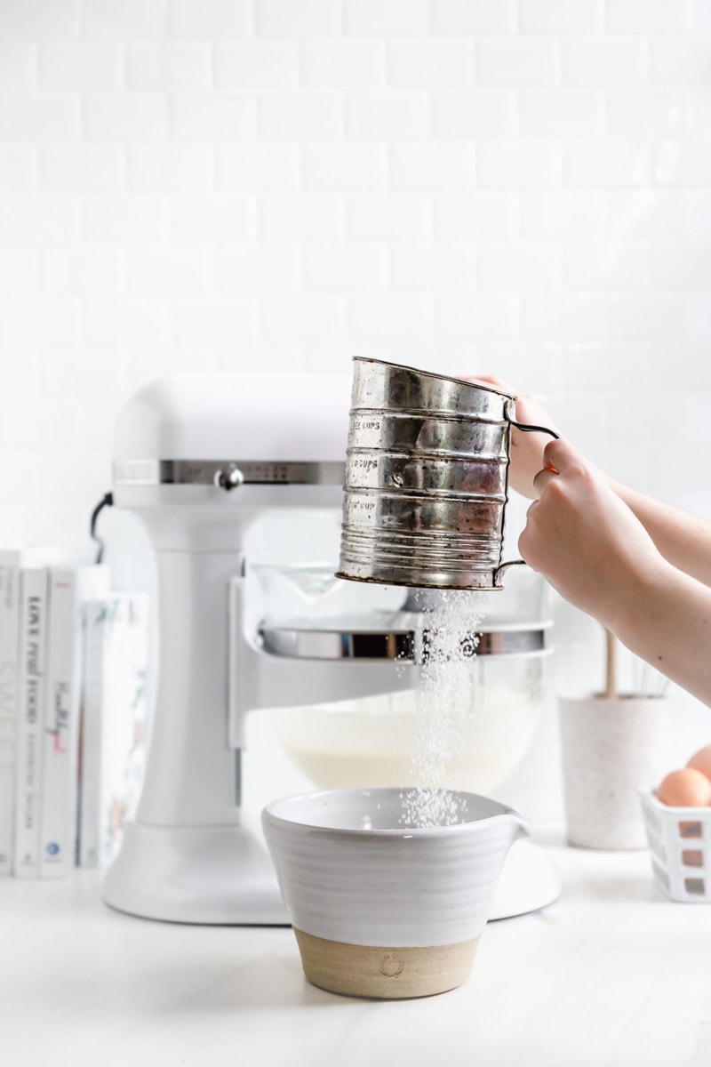 sifting flour together in a bowl
