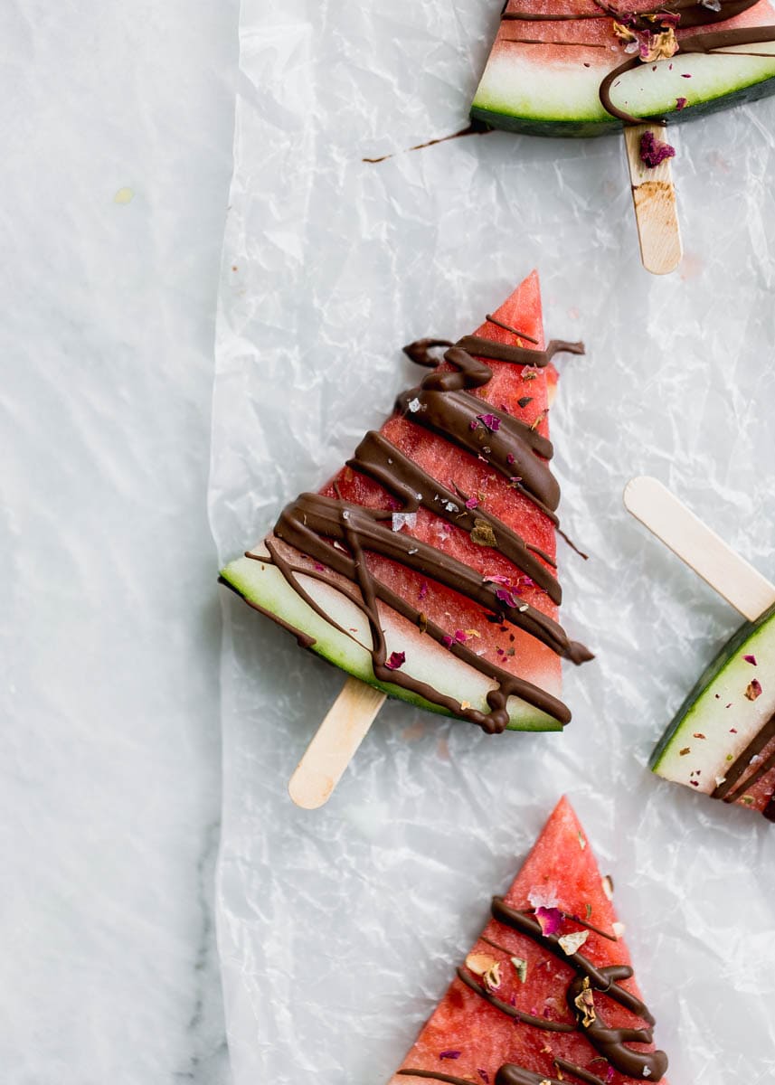 Low in sugar and totally refreshing, these fresh watermelon popsicles drizzled with chocolate and sea salt are the perfect treat on a hot summer's day!